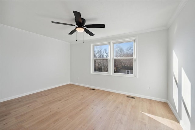 unfurnished room with light hardwood / wood-style floors, ceiling fan, and ornamental molding