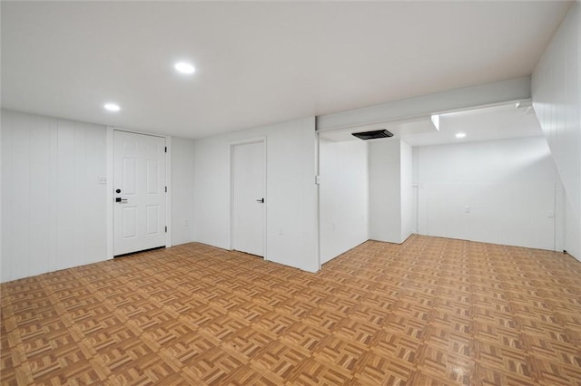 basement featuring light parquet flooring