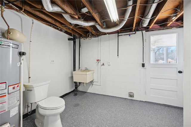 basement featuring gas water heater and sink