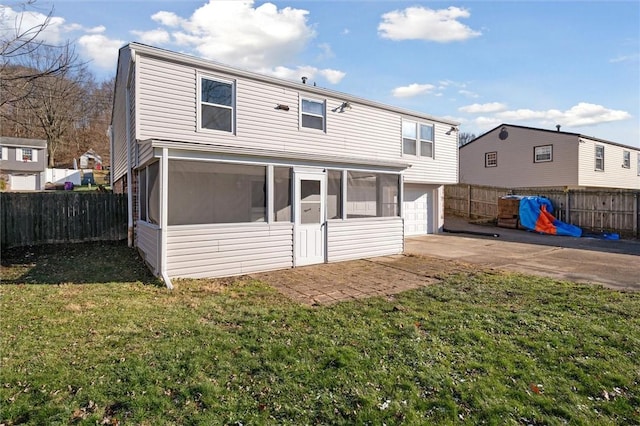 rear view of property with a sunroom and a yard