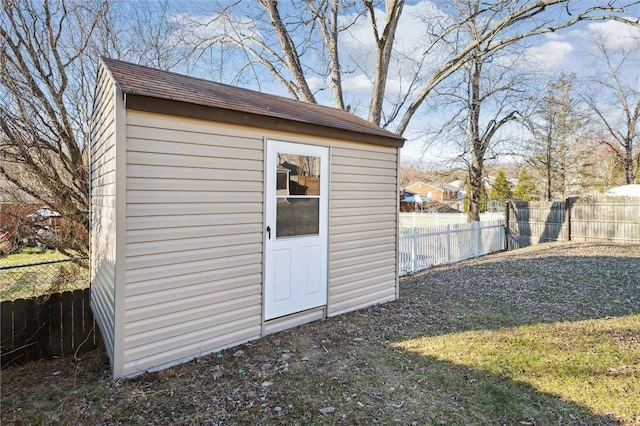 view of outbuilding with a lawn