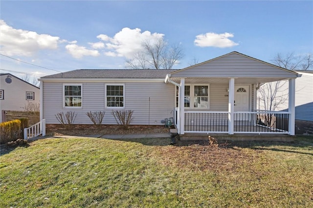 view of front facade featuring a front lawn and covered porch