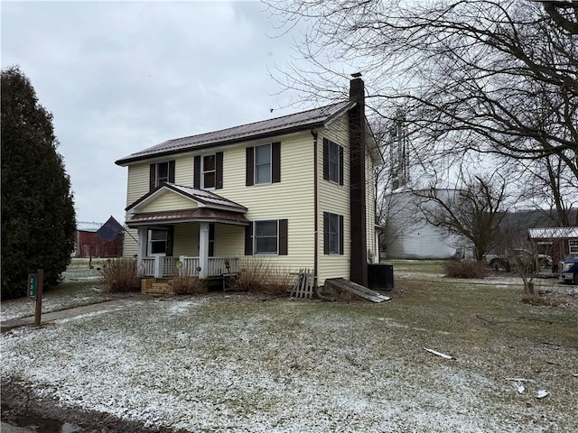 view of front of home featuring a porch and cooling unit