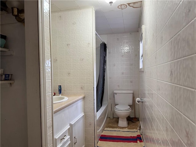 230 Gastown Rd, Plumcreek Twp, PA 15774 - bathroom with tile walls, vanity, shower / bath combo, and tile patterned flooring