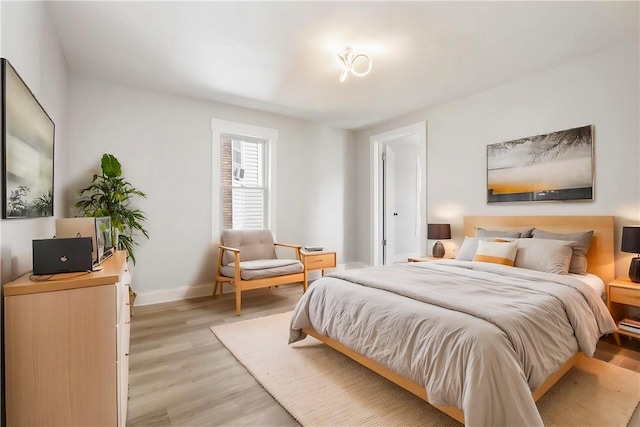 bedroom with light wood-type flooring