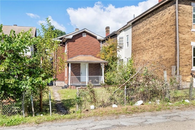 view of side of home featuring a porch