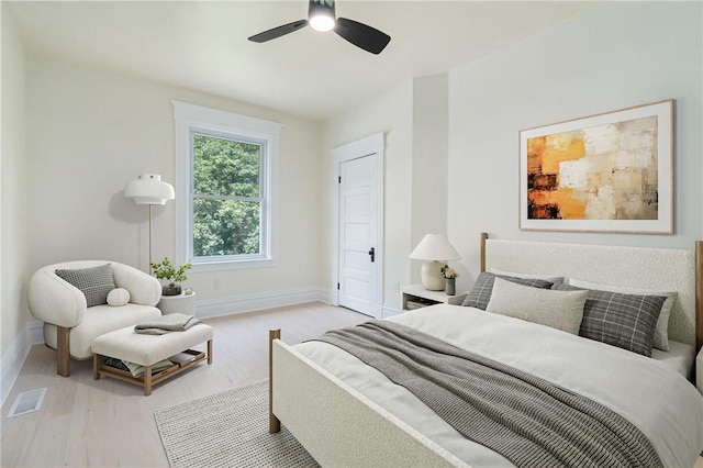 bedroom featuring light hardwood / wood-style floors and ceiling fan