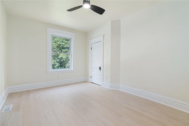 spare room with light hardwood / wood-style floors and ceiling fan