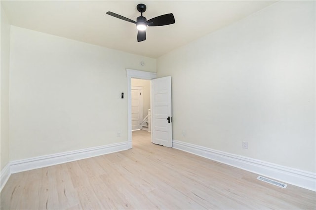 empty room featuring ceiling fan and light wood-type flooring