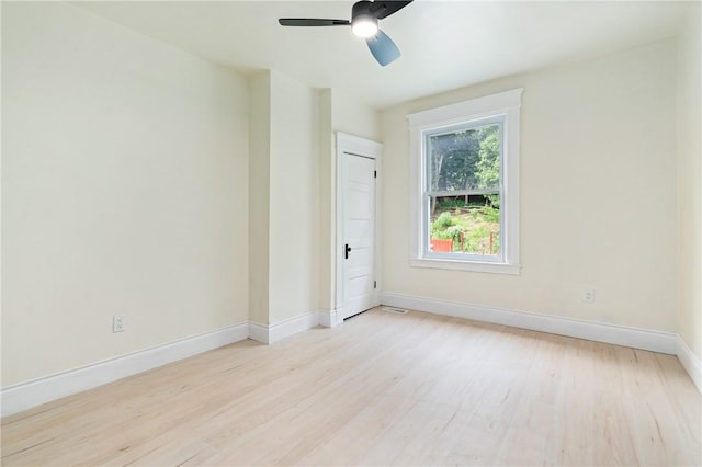 empty room featuring light wood-type flooring and ceiling fan