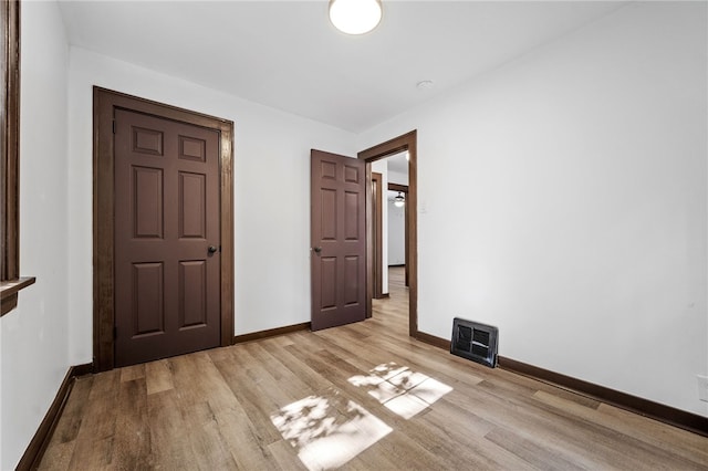 unfurnished bedroom featuring light hardwood / wood-style floors