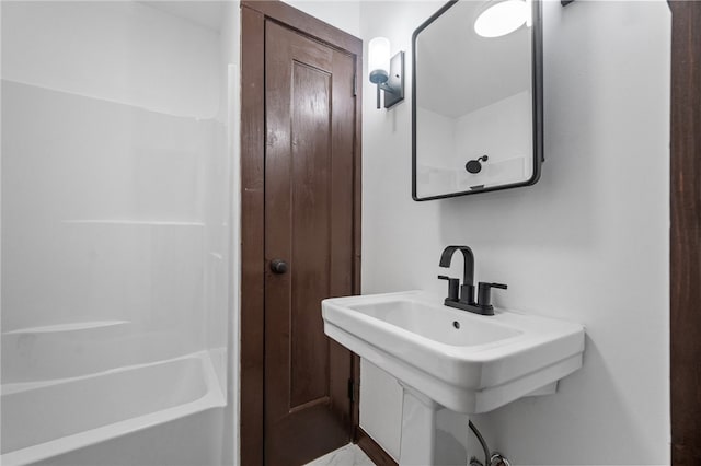 bathroom with sink and shower / bathing tub combination