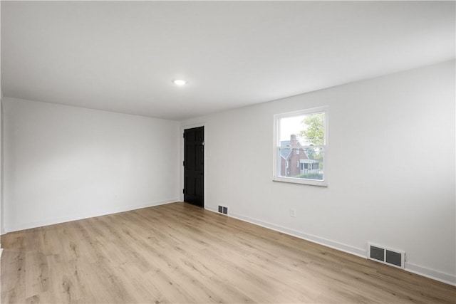 unfurnished room featuring light hardwood / wood-style flooring