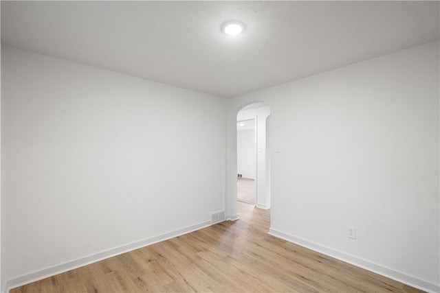 spare room with light wood-type flooring