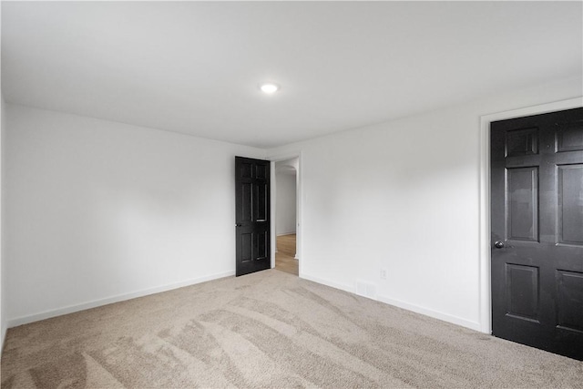 unfurnished room with carpet flooring