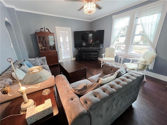 living room featuring ornamental molding, ceiling fan, and dark wood-type flooring