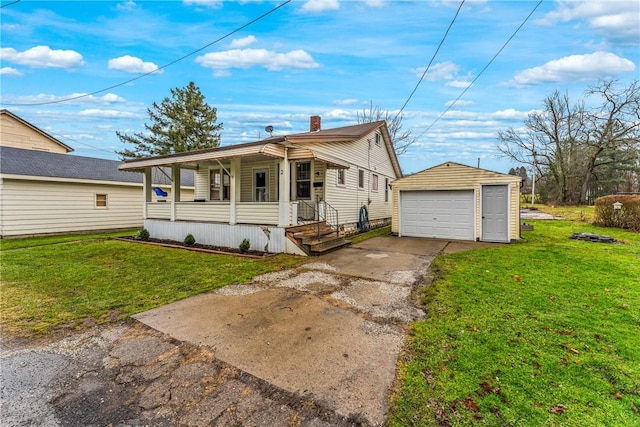 view of front of home with an outbuilding, a front lawn, a porch, and a garage