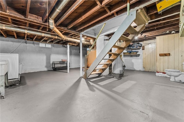 basement featuring washer / clothes dryer and water heater