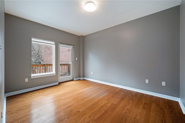 spare room featuring light hardwood / wood-style floors