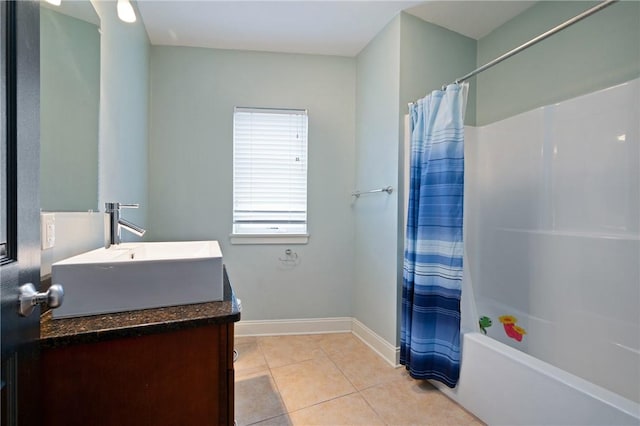 bathroom with tile patterned floors, vanity, and shower / tub combo