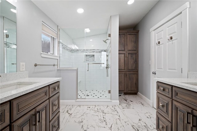 bathroom featuring vanity and an enclosed shower