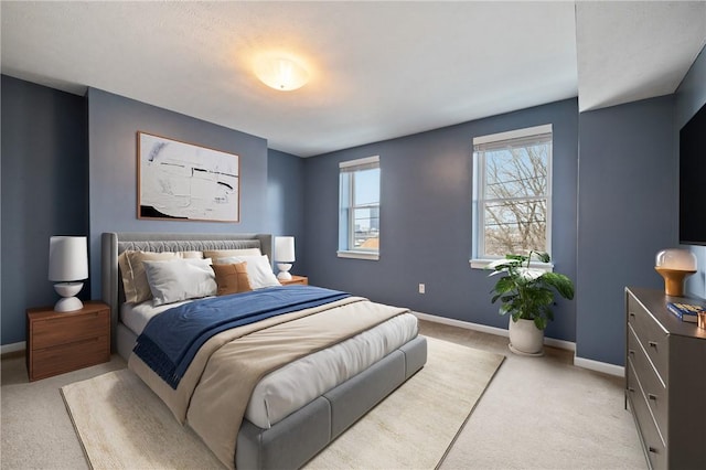 bedroom with light colored carpet