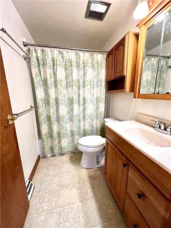 full bathroom with vanity, toilet, and shower / bath combo