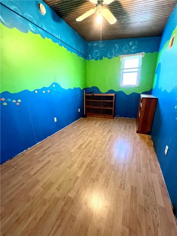 interior space with light hardwood / wood-style flooring and ceiling fan