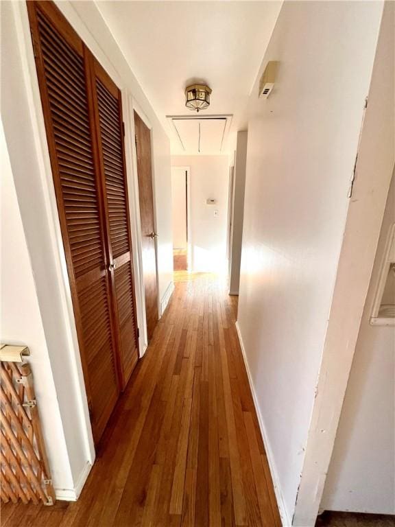 hallway featuring wood-type flooring