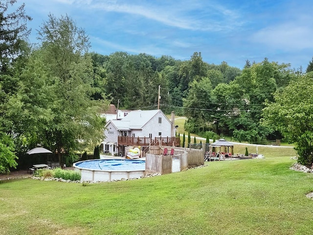 view of pool featuring a gazebo and a lawn