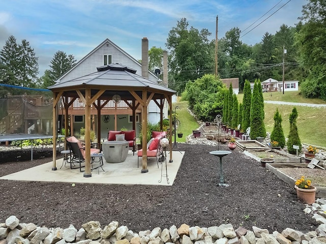 view of patio / terrace featuring a gazebo and a trampoline