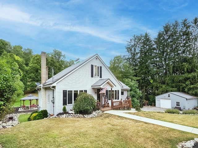 view of front of property featuring an outbuilding, a gazebo, a garage, and a front yard