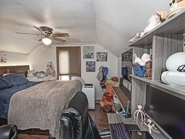 bedroom featuring ceiling fan, dark hardwood / wood-style floors, a textured ceiling, and vaulted ceiling