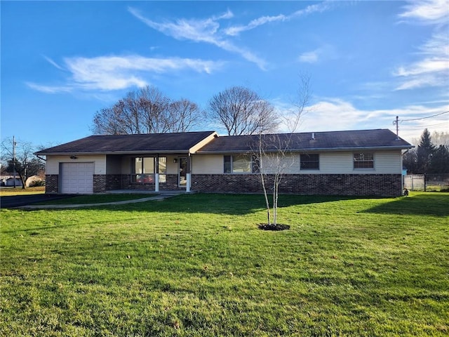 single story home featuring a garage and a front lawn