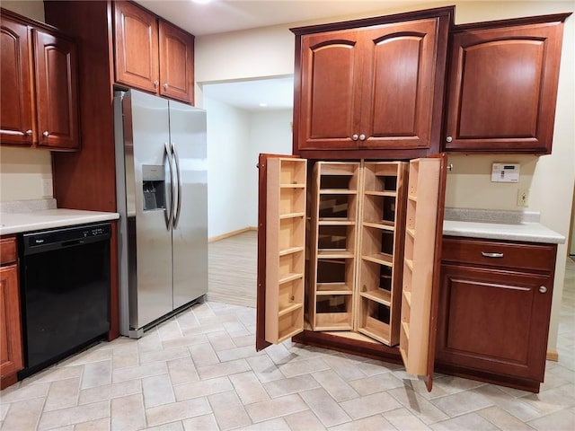 kitchen with stainless steel fridge and dishwasher