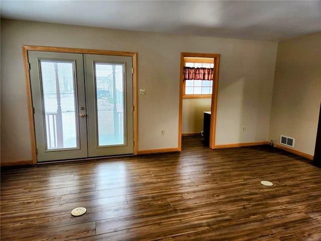 interior space featuring french doors and dark wood-type flooring