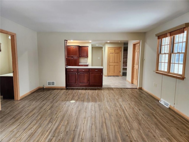 unfurnished living room featuring light hardwood / wood-style flooring