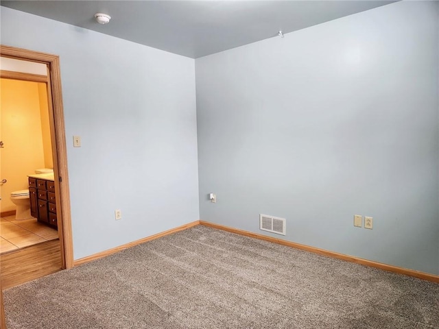 unfurnished room with carpet floors