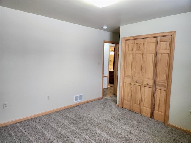 unfurnished bedroom featuring carpet flooring