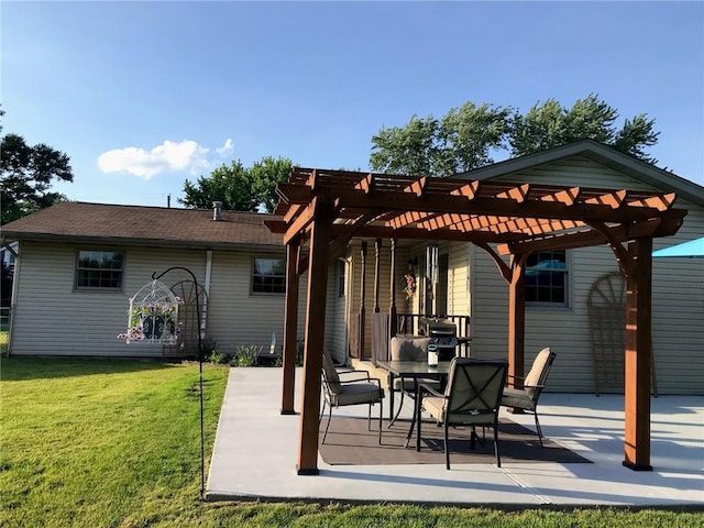 rear view of house with a lawn, a patio area, and a pergola