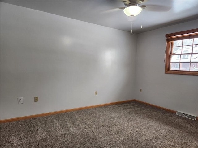 carpeted empty room featuring ceiling fan