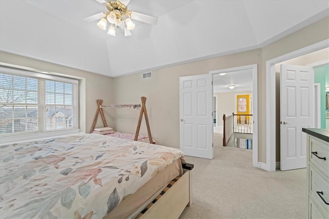 carpeted bedroom featuring ceiling fan and lofted ceiling