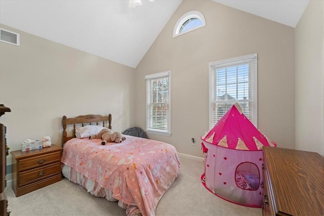 bedroom featuring light carpet and high vaulted ceiling