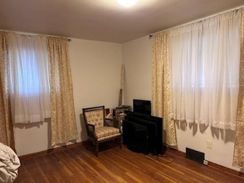 sitting room with hardwood / wood-style floors