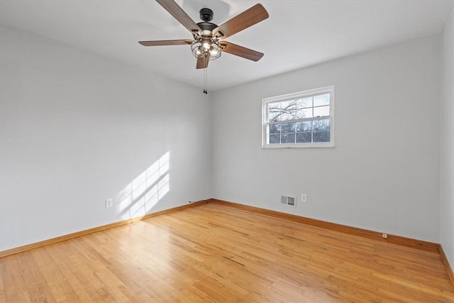 spare room with light hardwood / wood-style floors and ceiling fan