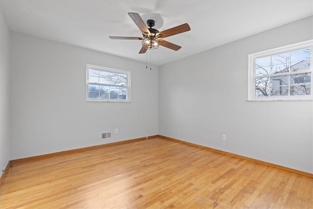 empty room with light hardwood / wood-style floors and ceiling fan