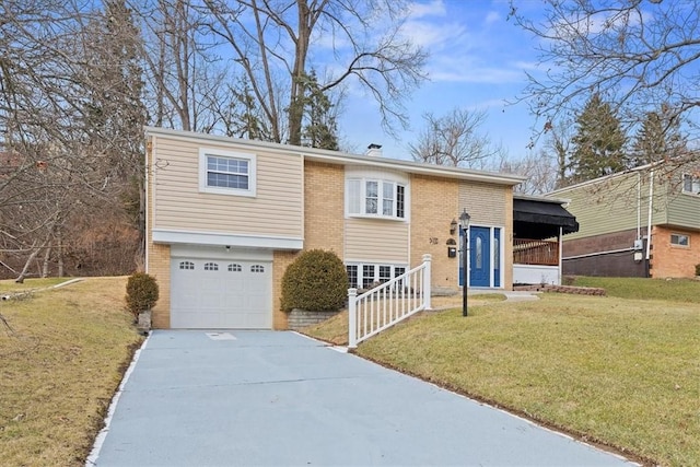 raised ranch with a garage and a front yard