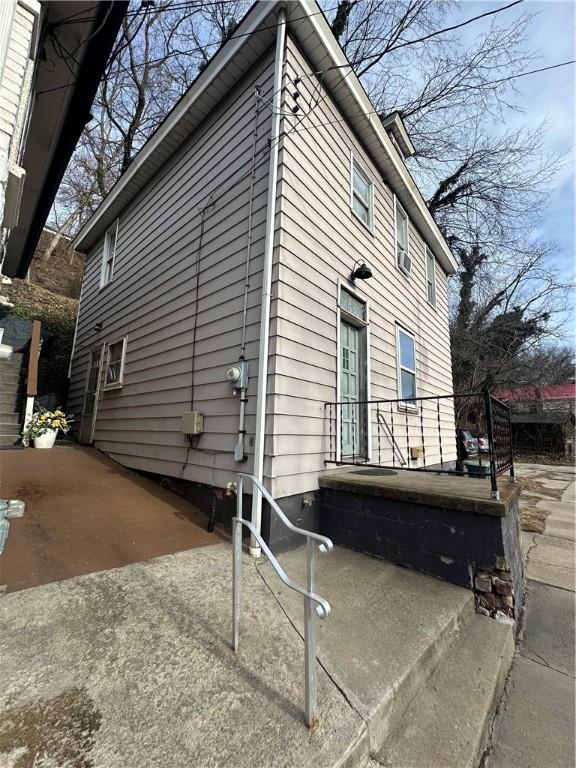 view of side of property featuring a patio