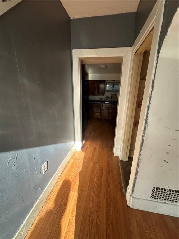 hallway featuring hardwood / wood-style flooring