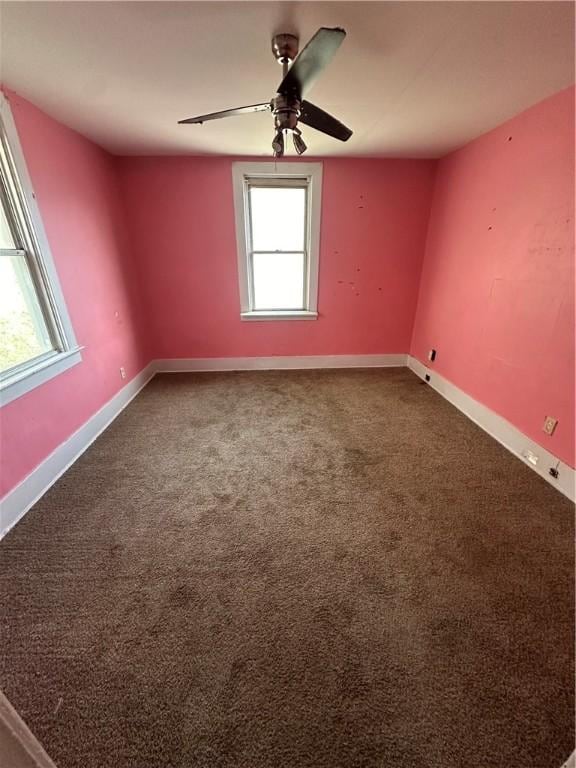 unfurnished room featuring carpet flooring and ceiling fan